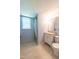 Bathroom featuring a vanity, toilet, shower, and a window at 1500 Prisma Ct, Raleigh, NC 27612