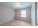 Bedroom featuring neutral walls, carpet, and a window for natural light at 1500 Prisma Ct, Raleigh, NC 27612