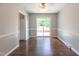 Bright dining room featuring a fan and hardwood floors at 1500 Prisma Ct, Raleigh, NC 27612
