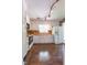 Bright kitchen with white cabinets, wood countertops, and wood backsplash at 1500 Prisma Ct, Raleigh, NC 27612