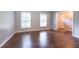 Spacious living room featuring lots of natural light and hard wood floors at 1500 Prisma Ct, Raleigh, NC 27612