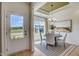 Bright dining room with natural light, modern chandelier, and views of the outdoors at 157 Mildred Pl, Broadway, NC 27505