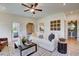 Bright and airy living room with stylish decor, hardwood floors, and seamless flow to other living spaces at 157 Mildred Pl, Broadway, NC 27505