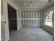 Bright living room with ample natural light and unfinished floors, ready to customize at 157 Mildred Pl, Broadway, NC 27505