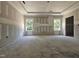 Large living room featuring modern trim, natural light, and unfinished floors at 157 Mildred Pl, Broadway, NC 27505