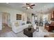Spacious living room with neutral decor, a large patterned rug, and an open layout to the kitchen at 157 Mildred Pl, Broadway, NC 27505