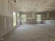 Interior view of a new home under construction, featuring bare walls, windows, and a spacious layout at 157 Mildred Pl, Broadway, NC 27505