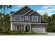 Charming two-story home with stone accents, a covered porch, and a two-car garage, perfect for modern living at 1701 Clydner Dr, Apex, NC 27523