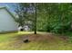 The backyard offers plenty of space for outdoor activities and enjoying nature at 180 Normandy Rd, Louisburg, NC 27549