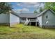 Spacious backyard with a small deck, ideal for relaxation and outdoor gatherings at 180 Normandy Rd, Louisburg, NC 27549