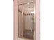 Bathroom showcasing a glass-enclosed shower with a decorative tiled surround at 180 Normandy Rd, Louisburg, NC 27549