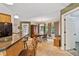 Cozy dining area with wooden table, chairs, and a built-in china cabinet, filled with natural light at 180 Normandy Rd, Louisburg, NC 27549