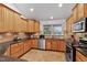 Updated kitchen with granite countertops, stainless steel appliances, and ample cabinet space at 180 Normandy Rd, Louisburg, NC 27549