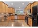 Updated kitchen with granite countertops, stainless steel appliances, and ample cabinet space at 180 Normandy Rd, Louisburg, NC 27549