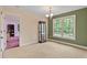 Open living area with a large window offering plenty of natural light at 180 Normandy Rd, Louisburg, NC 27549