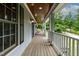 Charming porch with wood ceiling and floors, perfect for enjoying the outdoors at 180 Normandy Rd, Louisburg, NC 27549