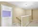 Upstairs hallway with carpet and light fixture leading to bedroom at 1826 Fillmore Dr, Creedmoor, NC 27522