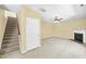 Inviting living room features plush carpet, fireplace and ceiling fan at 1826 Fillmore Dr, Creedmoor, NC 27522