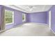 Spacious main bedroom with tray ceiling, ceiling fan, and bright windows at 1826 Fillmore Dr, Creedmoor, NC 27522