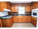 Well-lit kitchen featuring wood cabinets and countertop, offering ample space for meal preparation at 205 N Augusta Ave, Benson, NC 27504