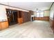 Inviting living room featuring a brick fireplace and ample natural light at 205 N Augusta Ave, Benson, NC 27504