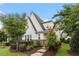 Charming home with white siding, brick accents, manicured landscaping and inviting curb appeal at 208 Jones Hill Rd, Holly Springs, NC 27540