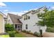 View of the home's side, showcasing the roofline, siding and screened porch at 208 Jones Hill Rd, Holly Springs, NC 27540