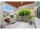 Relaxing screened porch with room for a grill and seating area at 208 Jones Hill Rd, Holly Springs, NC 27540