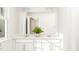 Bright bathroom with double vanity, ample counter space and a large mirror at 215 Carova Bnd, Apex, NC 27539