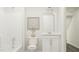 Bright bathroom featuring a tub and a vanity with white cabinets and contemporary decor at 215 Carova Bnd, Apex, NC 27539