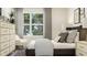 Comfortable bedroom boasts a large window, stylish furniture and a calming atmosphere at 215 Carova Bnd, Apex, NC 27539
