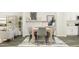 Chic living room featuring a dining area, decor shelves, and art, creating a stylish and welcoming atmosphere at 215 Carova Bnd, Apex, NC 27539