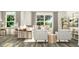 Bright living room with comfortable seating, stylish decor, and large windows, creating a warm atmosphere at 215 Carova Bnd, Apex, NC 27539