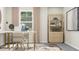 Bright home office with a modern desk, comfortable chairs, and elegant bookshelf offering ample storage at 215 Carova Bnd, Apex, NC 27539
