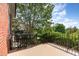 Relaxing patio with steel railing provides views of nature and is perfect for entertaining at 218 W Barbee Chapel Rd, Chapel Hill, NC 27517