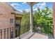 This covered balcony boasts tile floors and an iron railing system for safety and curb appeal at 218 W Barbee Chapel Rd, Chapel Hill, NC 27517