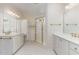 Spacious primary bathroom with double vanity, ample storage, walk in glass shower with gold frame and fixtures at 218 W Barbee Chapel Rd, Chapel Hill, NC 27517