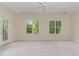 Large bright bedroom featuring a ceiling fan, and French doors leading to private balcony at 218 W Barbee Chapel Rd, Chapel Hill, NC 27517