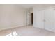 Spacious bedroom with double closet doors and neutral carpeting at 218 W Barbee Chapel Rd, Chapel Hill, NC 27517