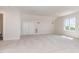 Bright, spacious bedroom with large window, neutral carpet and trim and double closet at 218 W Barbee Chapel Rd, Chapel Hill, NC 27517