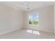 Neutral bedroom with a large window providing abundant natural light and pleasant views at 218 W Barbee Chapel Rd, Chapel Hill, NC 27517