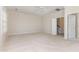 Large bright bedroom featuring neutral carpet, ceiling fan and 2 entry ways at 218 W Barbee Chapel Rd, Chapel Hill, NC 27517