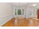 Bright dining room features beautiful hardwood floors and modern lighting fixture at 218 W Barbee Chapel Rd, Chapel Hill, NC 27517