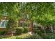 Charming brick townhome with mature landscaping and inviting curb appeal at 218 W Barbee Chapel Rd, Chapel Hill, NC 27517