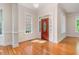 Bright foyer featuring hardwood floors, fresh paint and large windows offering ample natural light at 218 W Barbee Chapel Rd, Chapel Hill, NC 27517