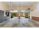 Spacious garage with epoxy floors, built-in cabinets, and view to exterior driveway at 218 W Barbee Chapel Rd, Chapel Hill, NC 27517