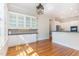 Open concept kitchen boasts hardwood floors and custom cabinetry, perfect for cooking and gathering at 218 W Barbee Chapel Rd, Chapel Hill, NC 27517