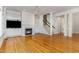 Inviting living area with hardwood floors, fireplace, custom built-ins and staircase at 218 W Barbee Chapel Rd, Chapel Hill, NC 27517