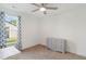 Clean, carpeted bedroom with large window and dresser at 221 Moon Cir, Dunn, NC 28334