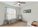 Bedroom features a window and ceiling fan with carpet at 221 Moon Cir, Dunn, NC 28334